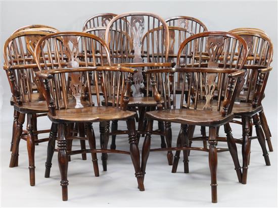 A harlequin set of thirteen early 19th century yew, elm and ash Windsor elbow chairs,